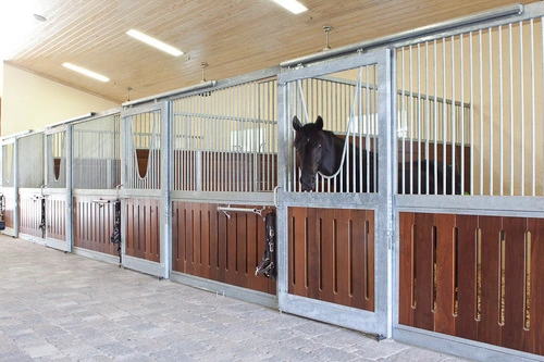 White painted stall fronts with mahogany lower panels and vertical bar upper grills