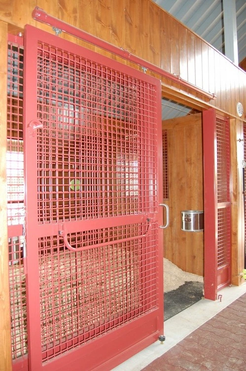 Red wire mesh decorative panel or door feature in dark wood paneled interior