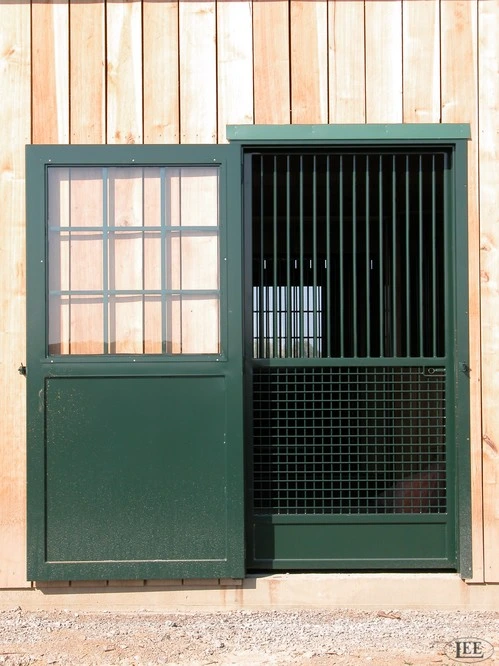 Forest green stall door with multi-pane window upper section and black grid mesh lower panel