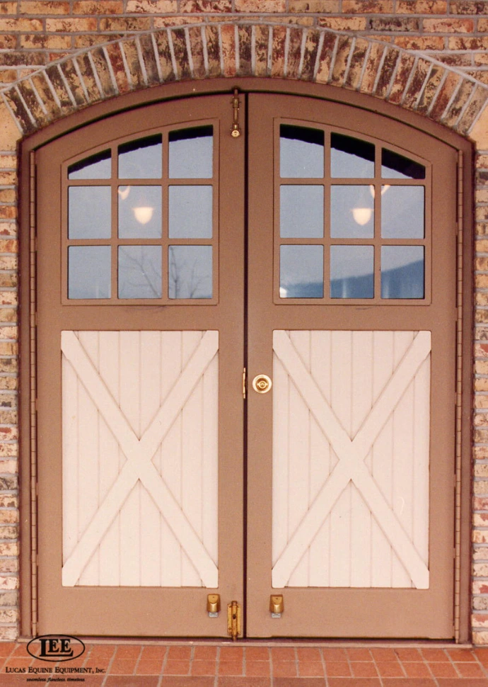Tan Aisle Entry Door with a brick facade