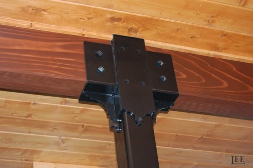 Black powder-coated metal bracket or hardware mounting piece on natural wood timber beam ceiling